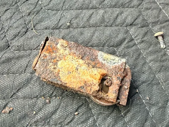 Worn and corroded sliding door rollers before replacement