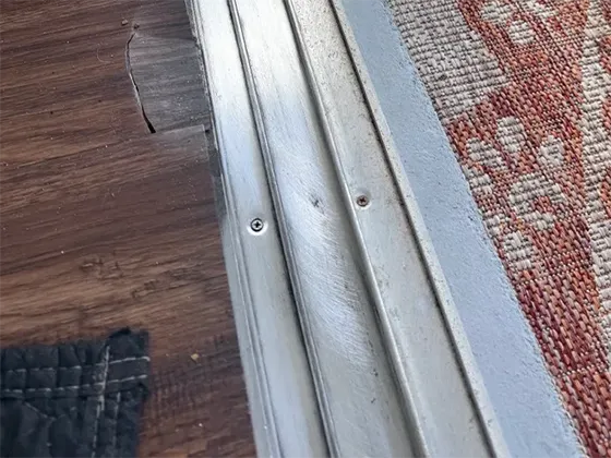 Track straightened and polished, door back on smooth glide