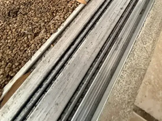 Pitted sliding door track before repair